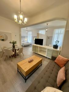 a living room with a couch and a table at elan RESIDENCE in Athens