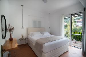 Postel nebo postele na pokoji v ubytování Christoforos Apartments