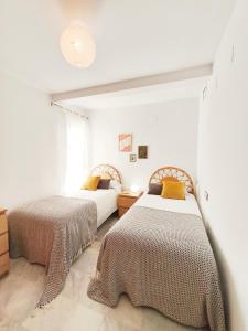 En eller flere senge i et værelse på Apto PETANCA, Retamar, Cabo de Gata