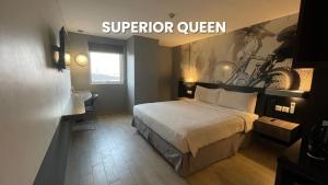 Postel nebo postele na pokoji v ubytování HORU HOTEL MANGGA DUA SQUARE