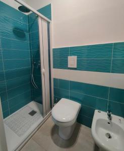 a bathroom with a toilet and a shower and a sink at Maison Salerno in Salerno +19 photos