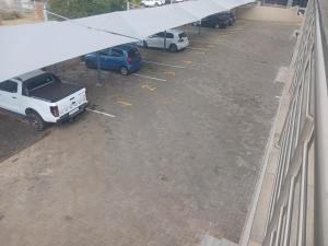 an overhead view of a parking lot with cars parked at Moll & Kie Luxury Accommodation in Burgersfort +10 photos