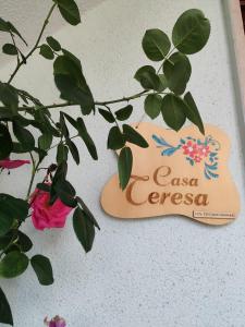 a sign for a casserole dish next to a plant at Casa Teresa in Tricase