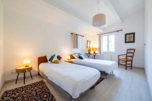 Postel nebo postele na pokoji v ubytování Chez Nelly - Villa avec vue imprenable