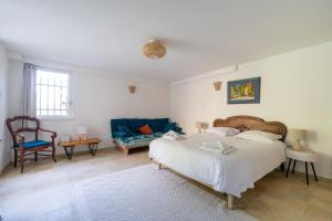 Postel nebo postele na pokoji v ubytování Chez Nelly - Villa avec vue imprenable
