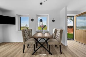 Televiisor ja/või meelelahutuskeskus majutusasutuses Ferienwohnung Winningmay III Füsing