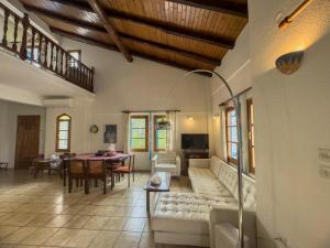 a living room with a couch and a table at Seaside Resort in Kritharia
