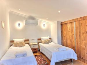 Postel nebo postele na pokoji v ubytování Villa Miramar Kalkan