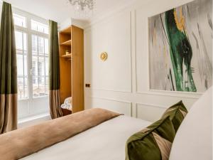 Łóżko lub łóżka w pokoju w obiekcie Merveil - Luxury Suite - Marais - Saint Martin I