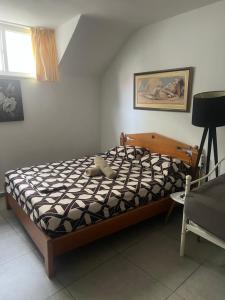 a bedroom with a bed with a stuffed animal on it at Centrally Located Private Rooms in Heraklio Town