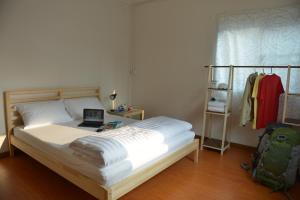 Postel nebo postele na pokoji v ubytování PanPan Hostel