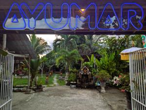 a sign for aulumulumulum resort with a garden at Ayumar Homestay Medewi in Pulukan +35 photos