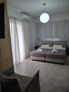Postel nebo postele na pokoji v ubytování Palmyra Hotel
