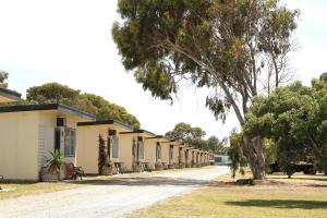 a row of houses on a dirt road at Port Lincoln Caravan Park in North Shields