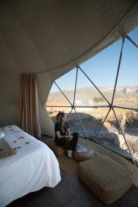 Postel nebo postele na pokoji v ubytování Jabal shams domes
