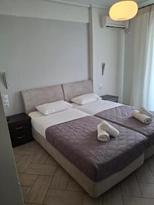 Postel nebo postele na pokoji v ubytování Palmyra Hotel
