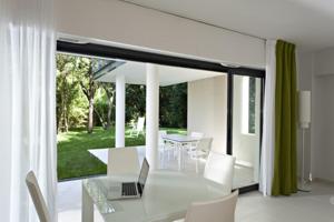 a dining room with a table and a laptop on it at Arthur Properties - Montfleury in Cannes