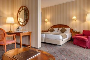 Letto o letti in una camera di Hotel De La Paix