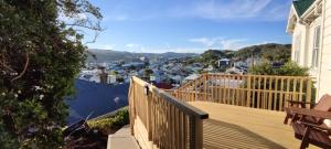 a balcony with a view of a city at Newtown Camp de Luxe in Wellington