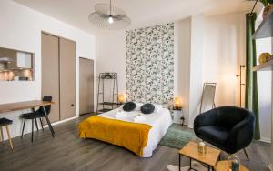 En eller flere senge i et værelse på Cap jungle 2pers Centre-ville fibre