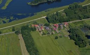 an aerial view of a large estate with houses and trees at Gäste-Zimmer am Elberadweg in Damnatz