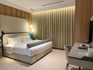 Sunway Tabuk Hotel客房内的一张或多张床位