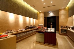 a restaurant with a buffet line with food at Hung's Mansion in Taichung