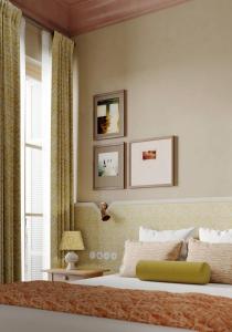a bedroom with a bed and a window at Hôtel Amista Marseille - ancien Hôtel Saint Louis - Vieux Port in Marseille