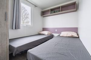 Postel nebo postele na pokoji v ubytování Camping Meerwijck - Waterwijck 7