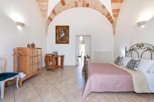 Postel nebo postele na pokoji v ubytování Domus Aviae - No ZTL