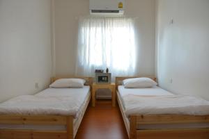 Postel nebo postele na pokoji v ubytování PanPan Hostel