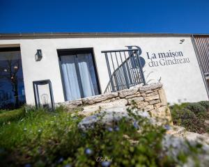 a building with a sign that reads la mission cut chapel at La Maison du Gindreau in Saint-Médard