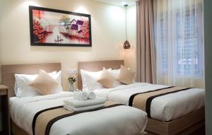 Postel nebo postele na pokoji v ubytování Budhanilkantha Homestay + 31 fotografií
