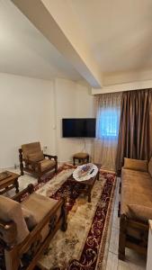a living room with a couch and a table at Guest House Siatista in Siátista