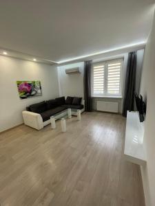 Un televizor și/sau centru de divertisment la Apartamenty Sienkiewicza