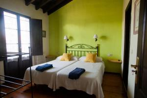 Ένα ή περισσότερα κρεβάτια σε δωμάτιο στο Casa Rural La Cerra
