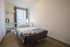 Posteľ alebo postele v izbe v ubytovaní Hostal San Pelayo
