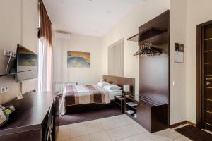 Postel nebo postele na pokoji v ubytování Incognito Boutique Hotel + 32 fotografií