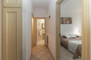 a hallway leading to a bedroom with a bed at Villa Cecilia in Sciacca +33 photos