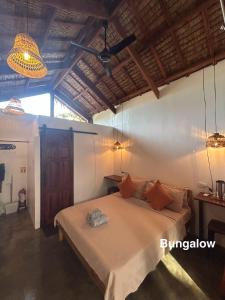 Postel nebo postele na pokoji v ubytování Wayans Siargao Homestay