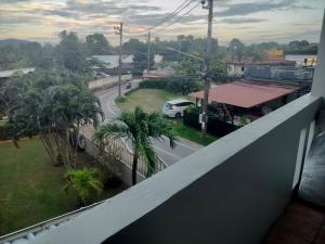 a view of a street from the balcony of a building at the three pyramids in Rawai Beach