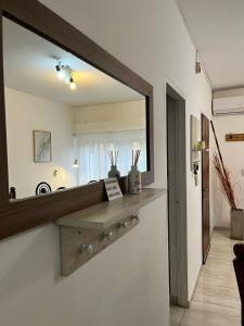 a large mirror on the wall of a bathroom at Casa en Santa Rosa in Santa Rosa