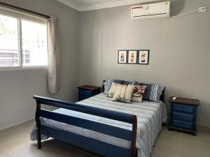 Ένα ή περισσότερα κρεβάτια σε δωμάτιο στο Refúgio Aconchegante no Recife, a Poucos Minutos da UFPE