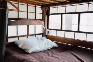 Postel nebo postele na pokoji v ubytování Koya Backpackers + 13 fotografií