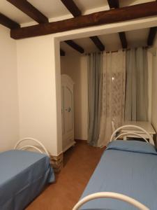 Postel nebo postele na pokoji v ubytování Angolo relax a due passi dal mare
