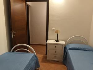 Rúm í herbergi á Angolo relax a due passi dal mare