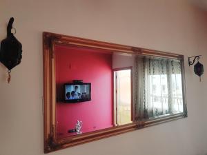 Televisyen dan/atau pusat hiburan di Red Apartamento