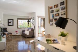 a living room with a tv on a wall at Xativa Terrace II in Valencia