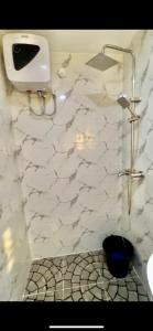 a white bathroom with a sink and a toilet at Konar-Apts, Cozy Room with private kitchen, City view Balcony, 24hrs power, Security, Wifi, Gwarinpa Express by Dawaki Junction in Gwarinpa
