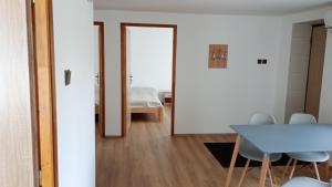 a room with a table and chairs and a bedroom at Apartmán Mělník 330 in Mělník